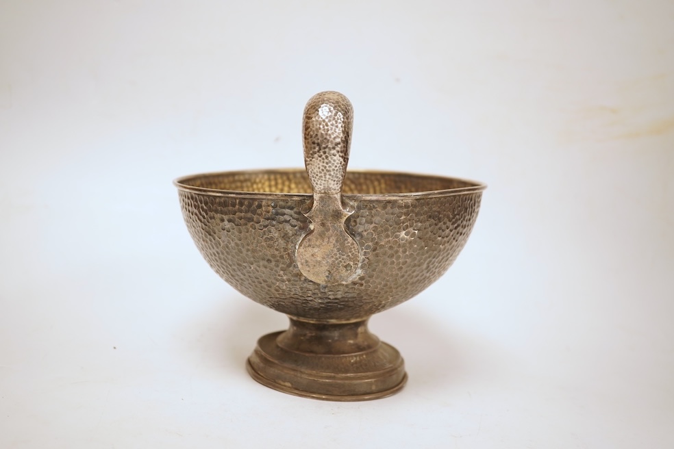 A hammered white metal two handled pedestal bowl, stamped 'Kennedy 925, diameter 18.9cm, 18.1oz.